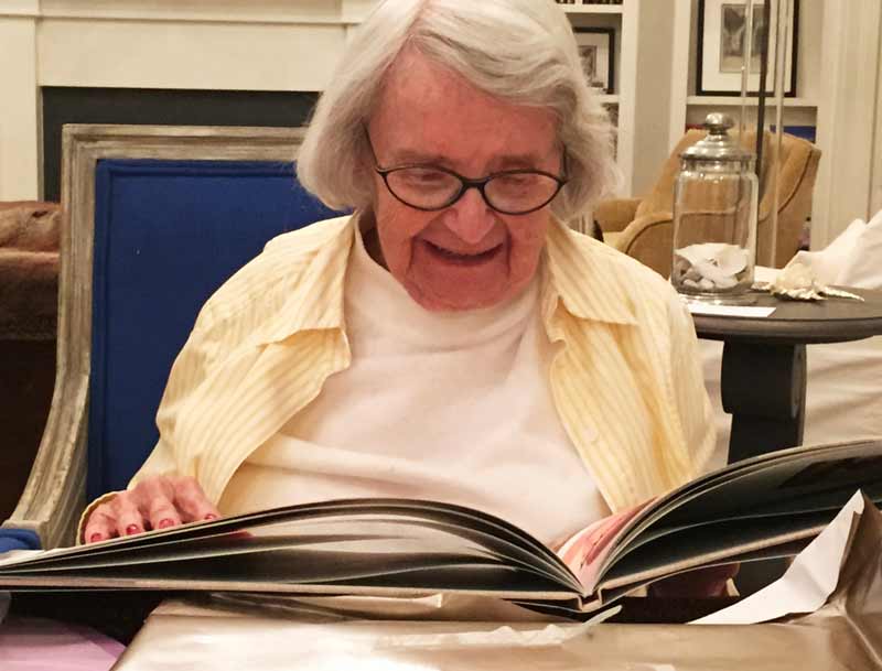 Mary Jane Cochran enjoying a new book on her 90th Birthday.